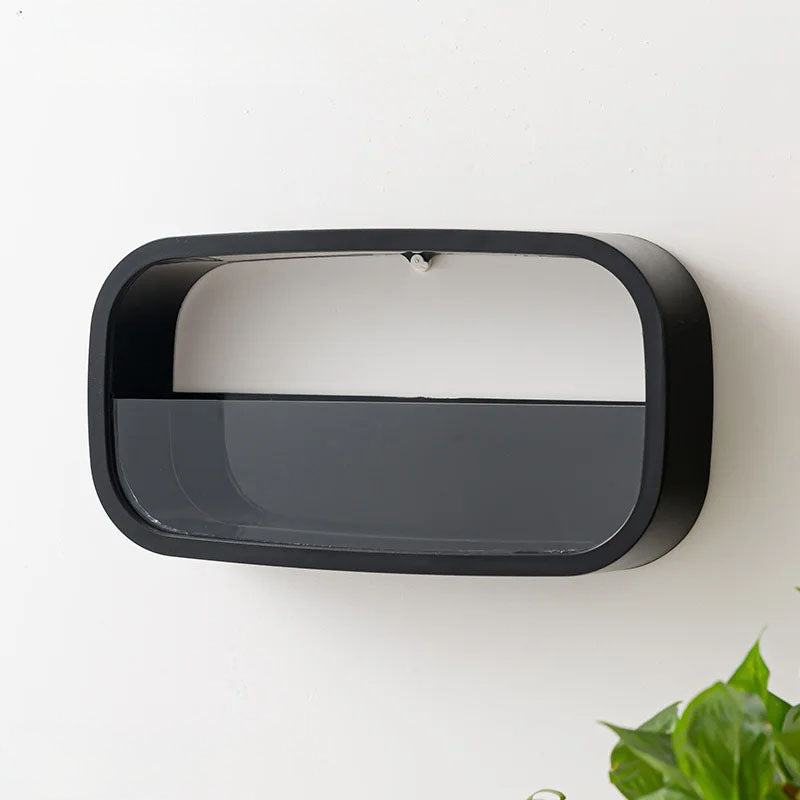 Rectangular wall-mounted mirror with black frame on a white wall.