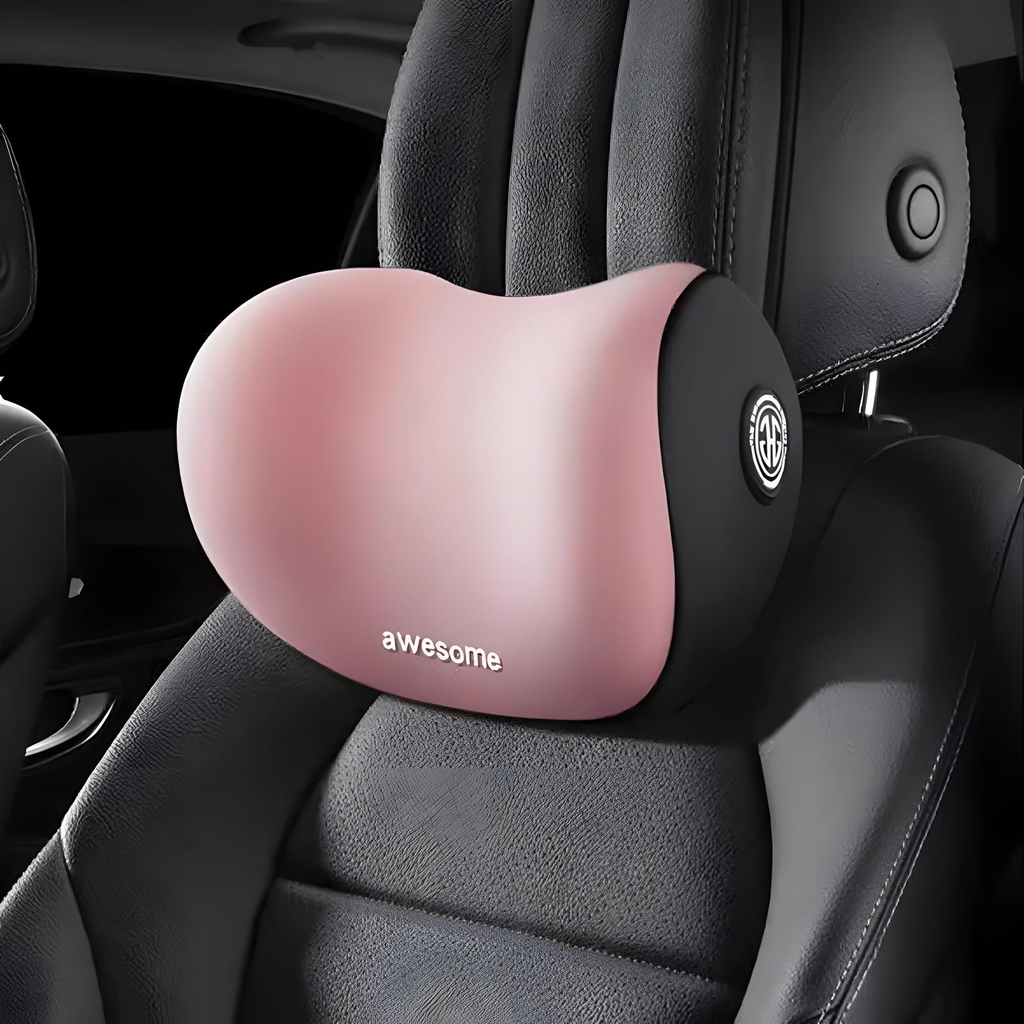 A pink and black car seat neck pillow with the word 'awesome' printed on it, shown resting on a black leather car seat.