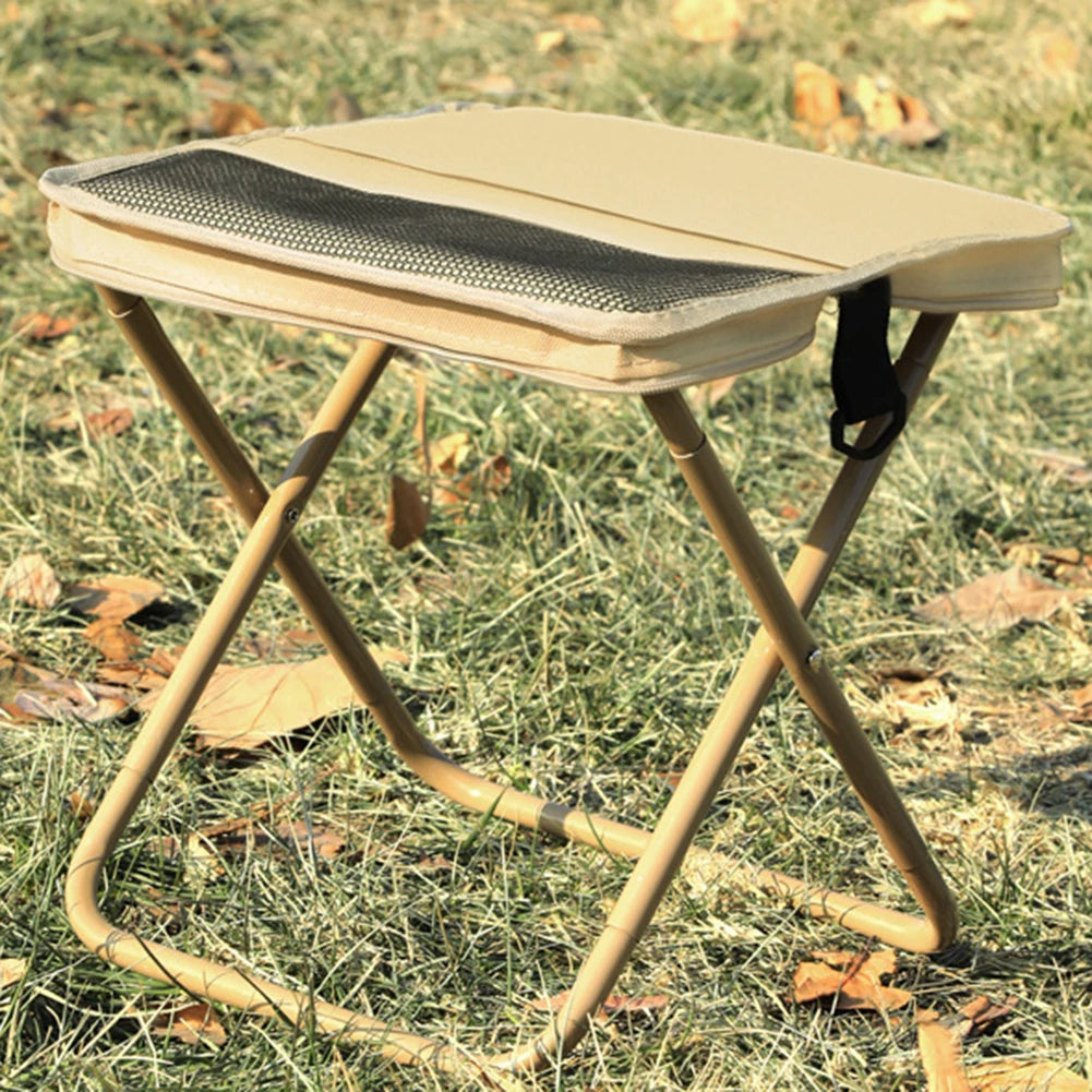 Foldable stool with mesh seat on grass