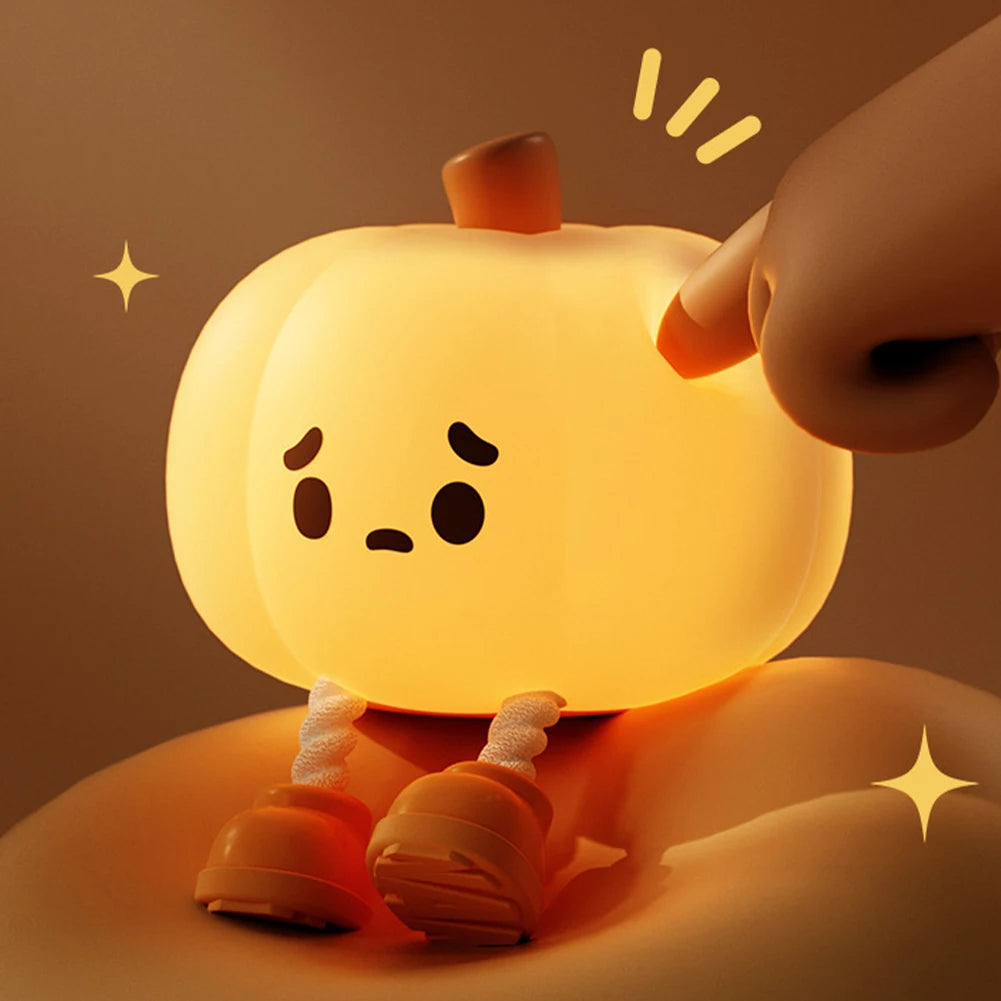 Cute cartoon character night light with a hand interacting with it on a warm brown background.