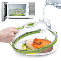 Microwaveable food cover with salmon dish inside, placed in front of a microwave.