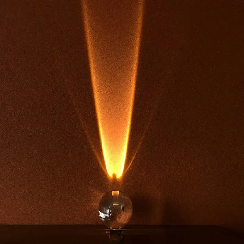 Light bulb emitting a beam of light against a dark background