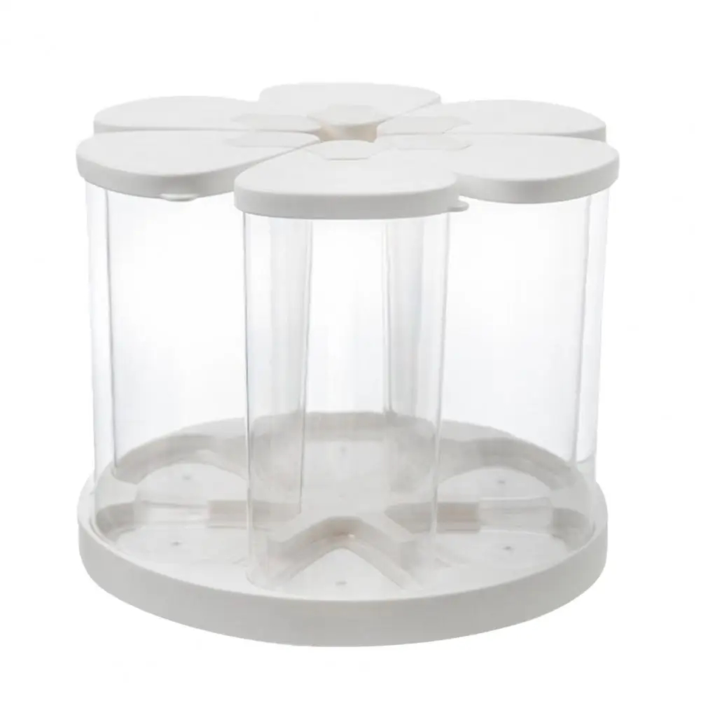A white and clear plastic 6-compartment organizer with a flower-shaped top and a round base, shown on a solid white background.