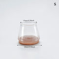 Clear glass container with measurements on a white background