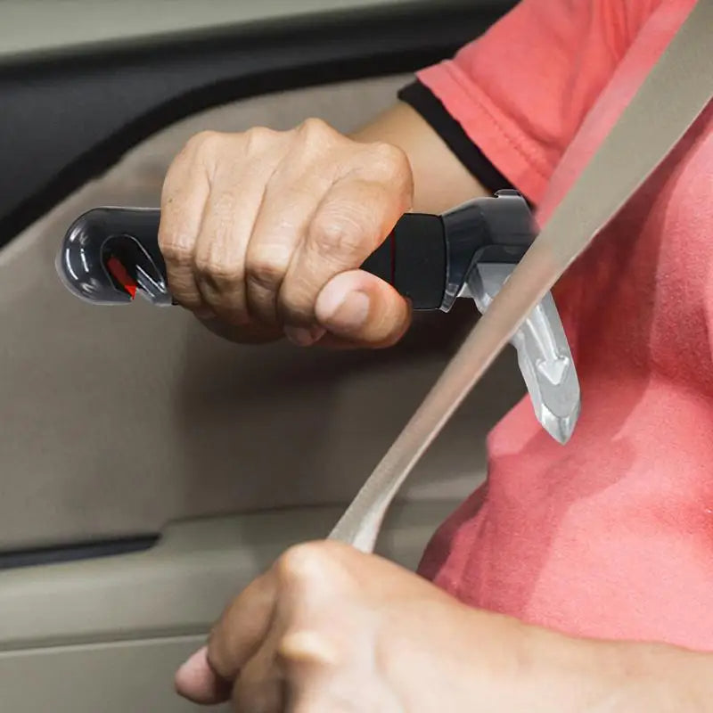 Person using a car door lock pick tool to unlock a car door.
