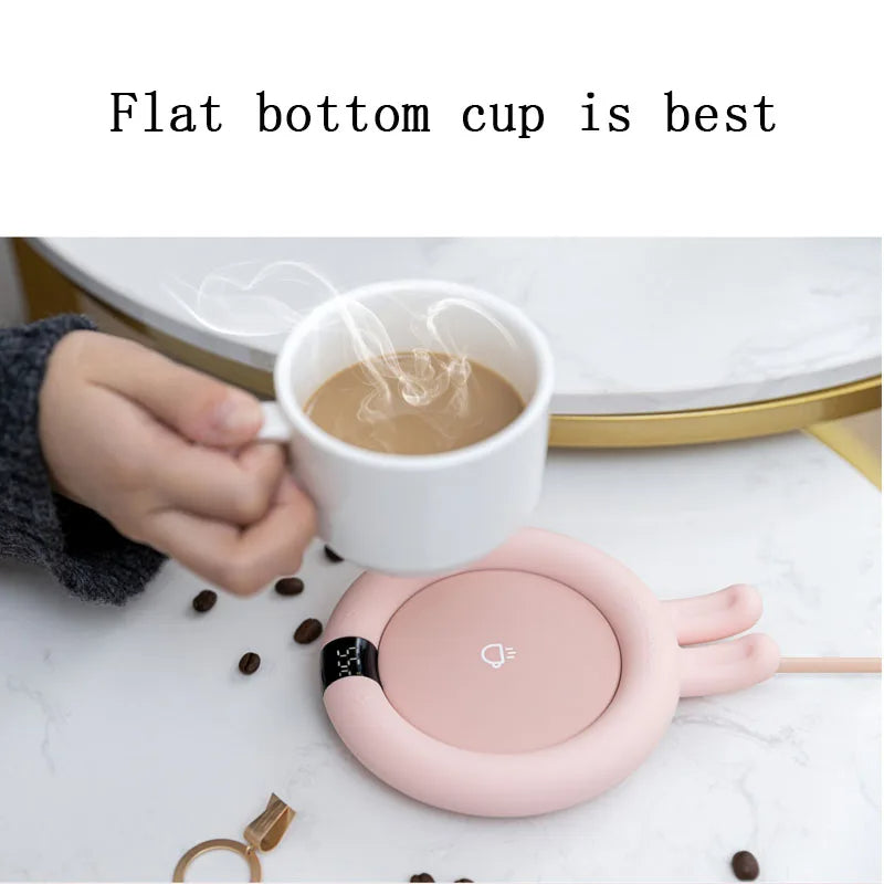 Coffee mug warmer keeping a drink warm on an office desk