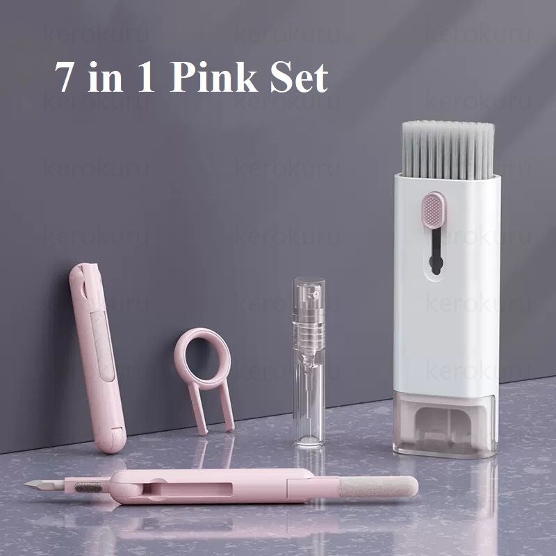 7-in-1 pink grooming set with various tools on a gray surface against a dark background.