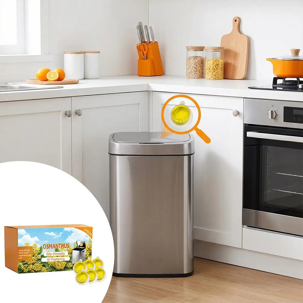 A stainless steel trash can in a modern white kitchen, with an orange graphic callout highlighting the lid's yellow reflective material. An inset circle in the bottom-left shows the product packaging and several small yellow reflective accent pieces.