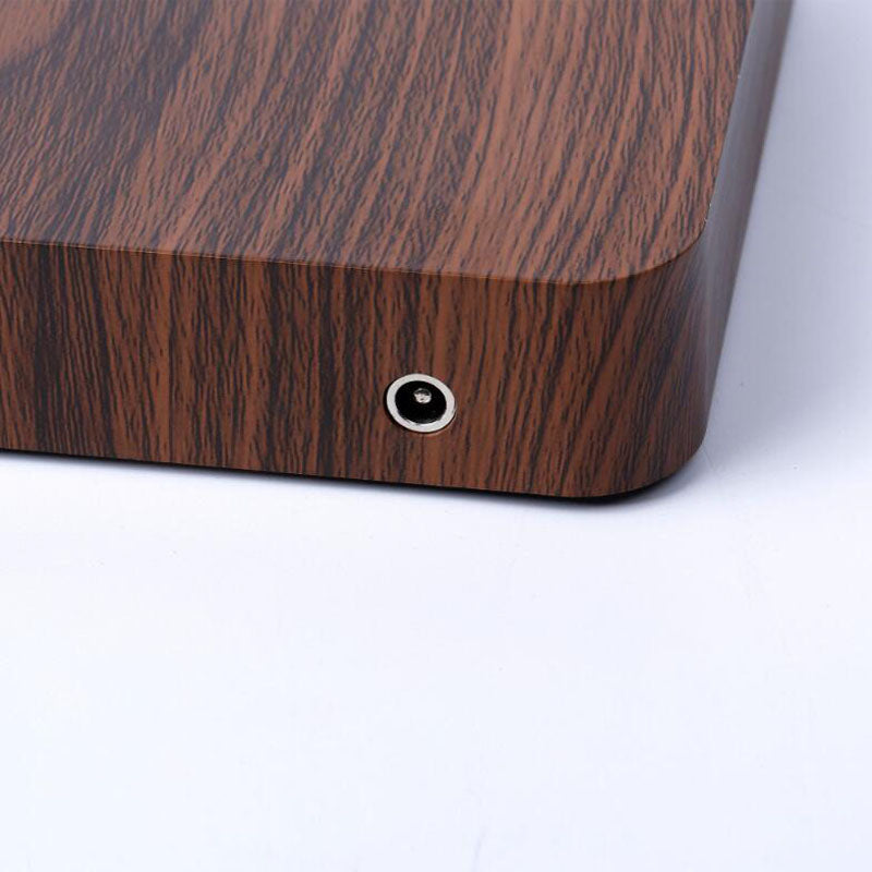 Levitating moon light suspended above wooden display base