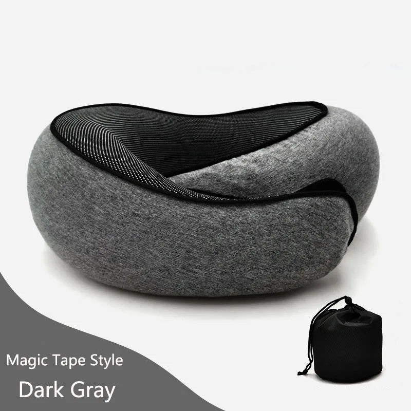 Gray neck pillow with black strap on a white background