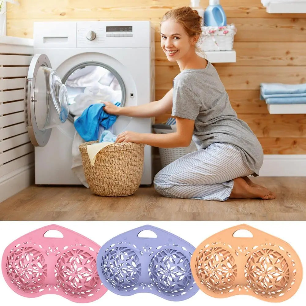 Woman loading laundry into a washing machine with three colorful laundry baskets displayed below.