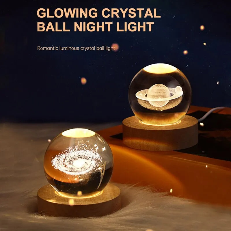 Glowing crystal ball night light with wooden base on a dark background