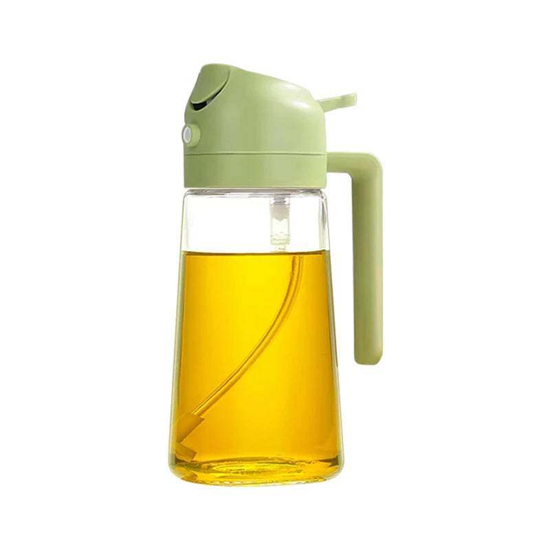Glass oil dispenser with green lid and handle on a white background