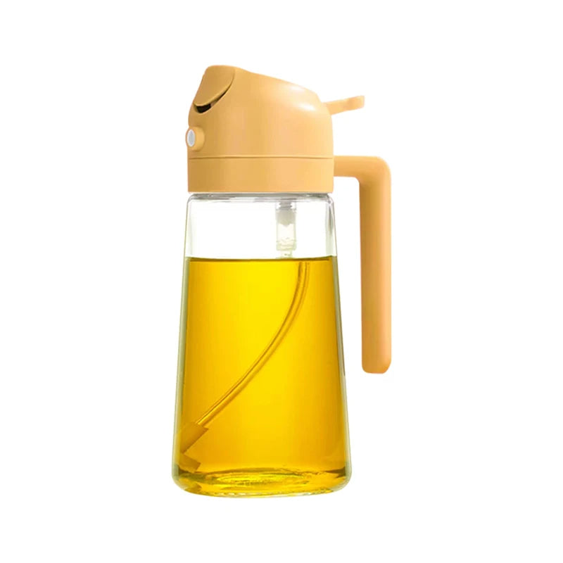 Glass oil dispenser with a yellow cap and handle on a white background