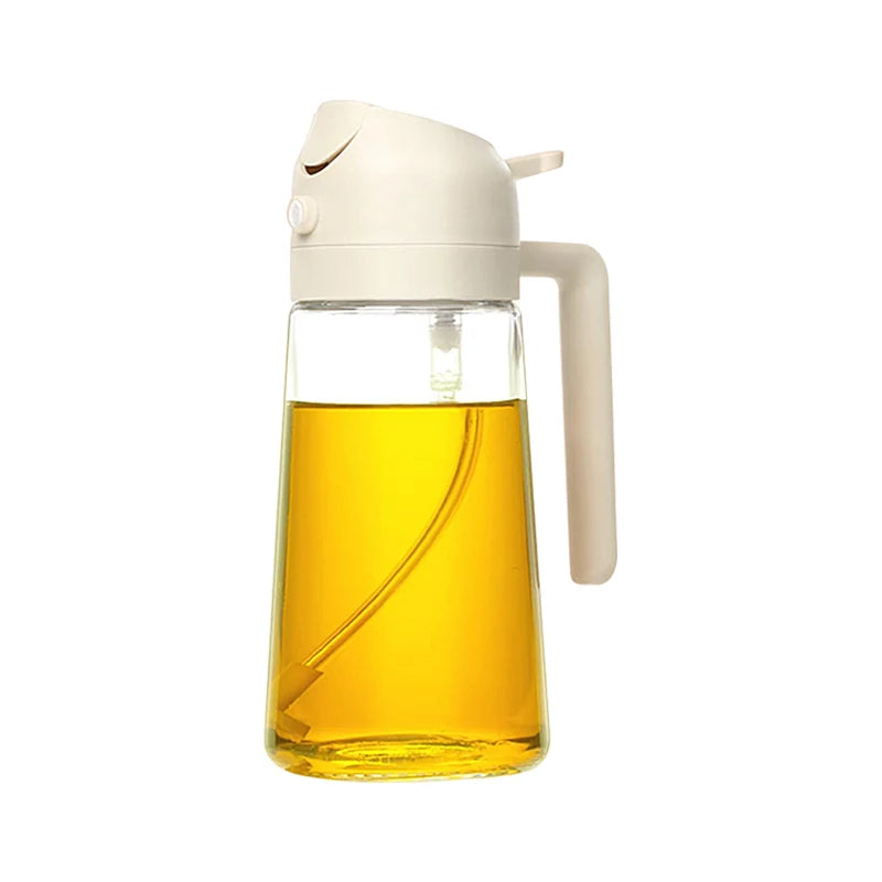 Glass oil bottle with a white cap and handle on a white background