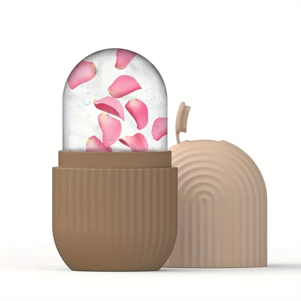 Decorative glass dome with pink flower petals inside, placed on a wooden base.