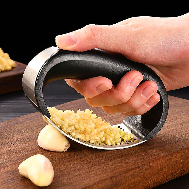 Stainless steel garlic press for crushing fresh garlic