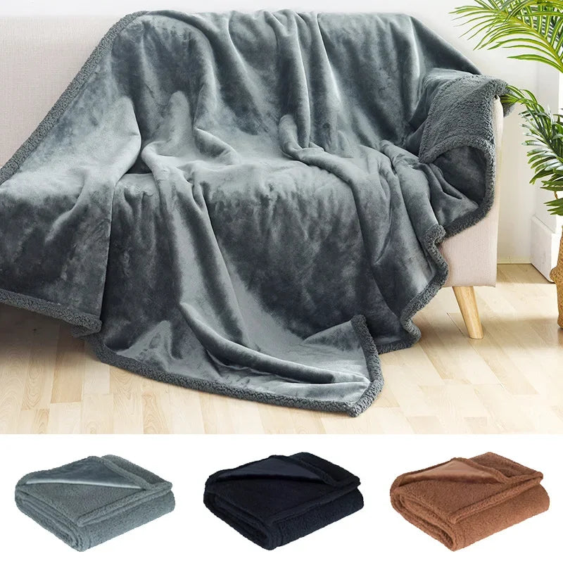 Gray blanket draped over a chair with additional colors shown below